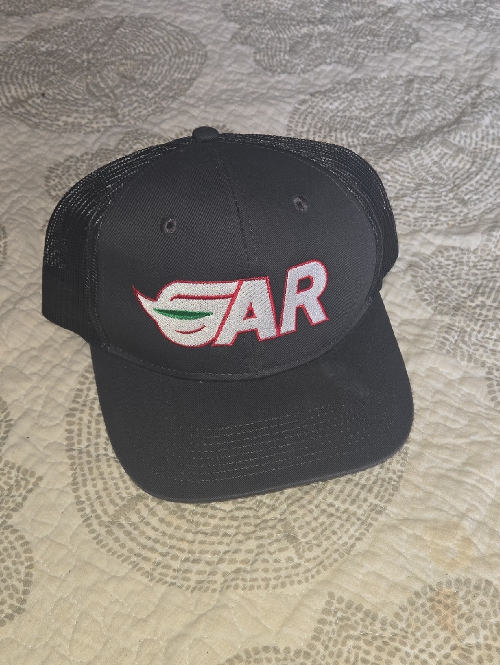 Port Authority Black Trucker Hat with Red & White Embroidered AR Logo